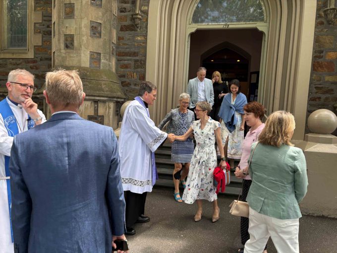 Bishop Paul Smith congratulates Karen.
